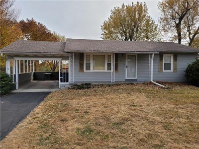 Ranch-style home with a front lawn | Image 1