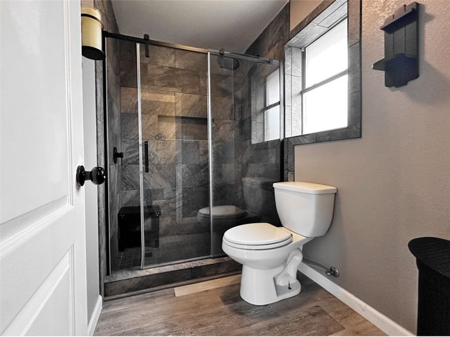 Updated primary bathroom with spa shower | Image 25