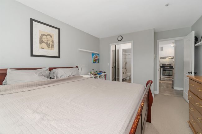 Bedroom with light carpet and ensuite bathroom | Image 20
