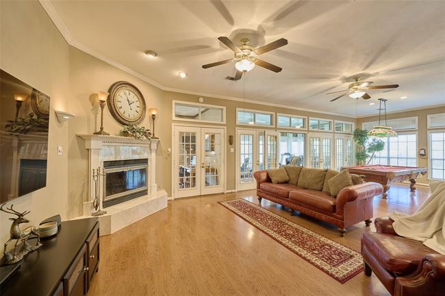 Tons of windows and natural light...choose to open or close any of the 5 sets of french doors | Image 19