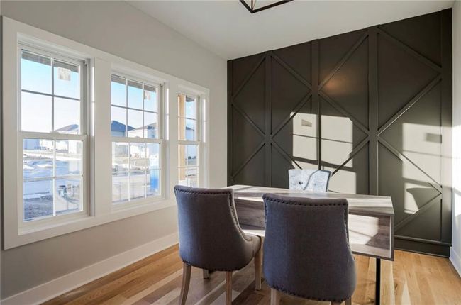 Dining area featuring plenty of natural light, baseboards, and light wood-style flooring | Image 13