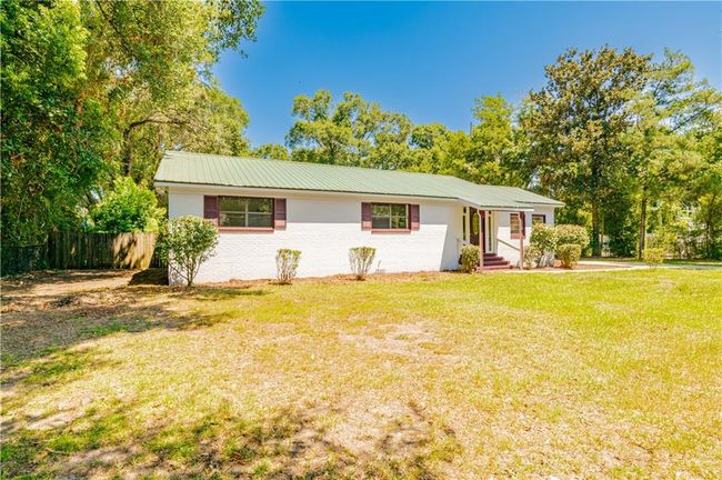 Single story home with a front yard | Image 6