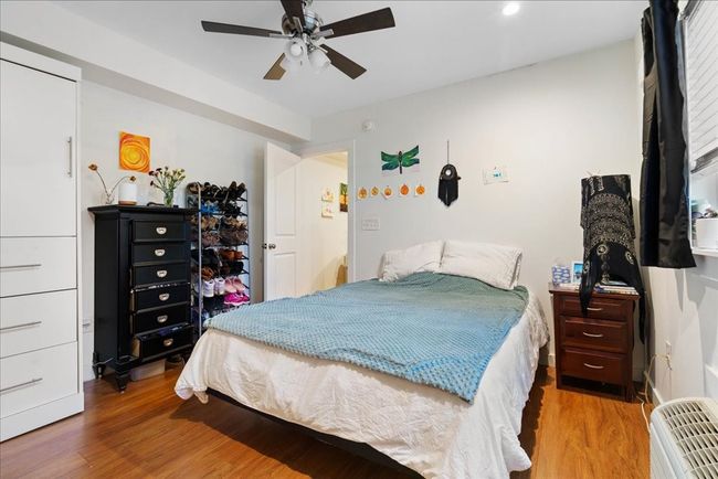 The bedroom includes recessed lighting and laminate flooring throughout. | Image 9