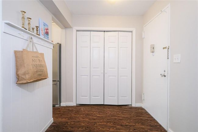 Close-up of spacious entryway featuring a large closet. | Image 4