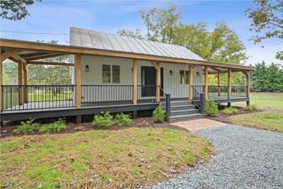 Country-style home featuring covered porch | Image 2