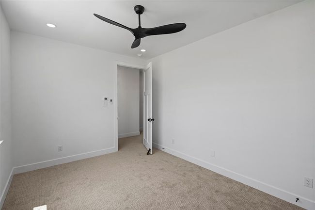 Spacious upstairs 4th bedroom, ideal for guests or a home office. | Image 34