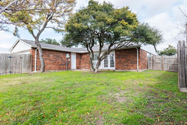 Rear view of property featuring a lawn | Image 22