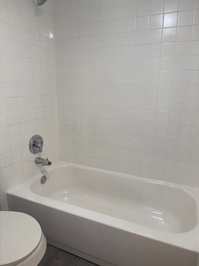 Full bathroom featuring toilet and shower combination | Image 12