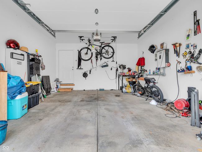 garage with a garage door opener | Image 22