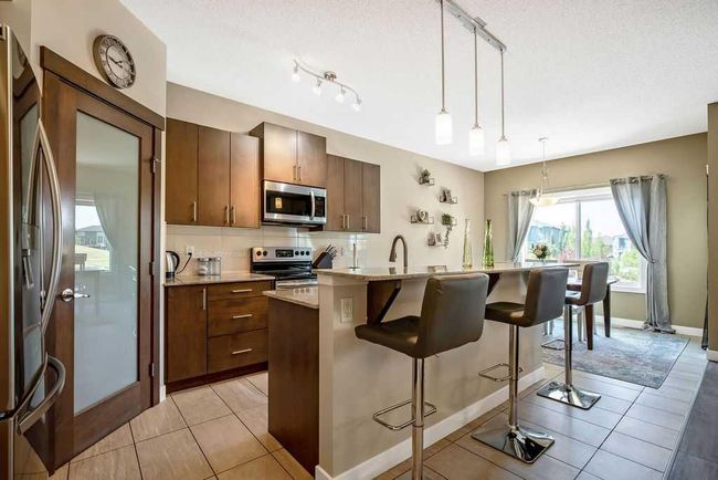 5 Drake Landing Loop, House detached with 3 bedrooms, 2 bathrooms and 5 parking in Okotoks AB | Image 6