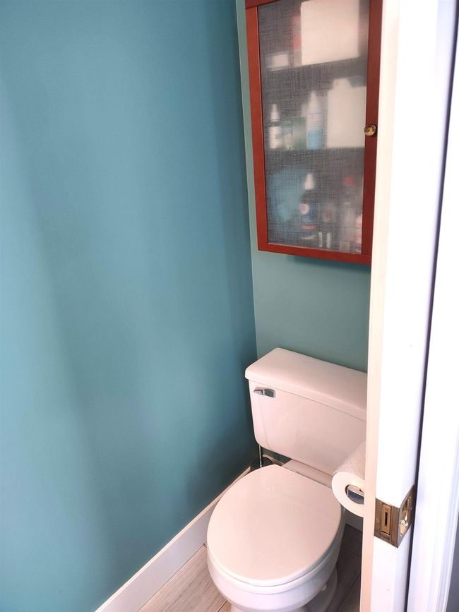 Bathroom with toilet and baseboards | Image 21