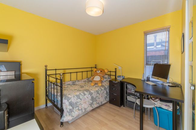 Bedroom featuring wood finished floors and a desk | Image 25