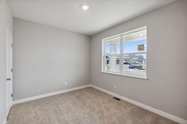 Desirable main floor bedroom with full bath. Model photo. Options and colors will vary. | Image 15