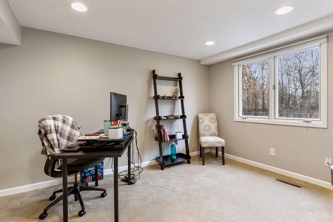 Bedroom five, lower level - currently used as an office | Image 38