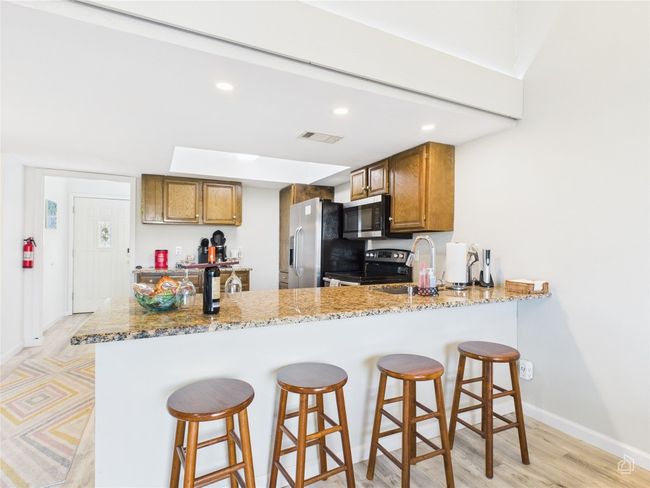 Open kitchen with lot's of natural light. | Image 13