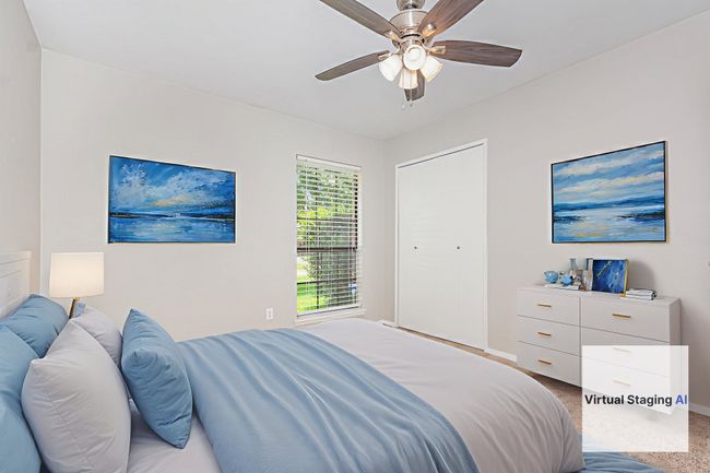 virtually enhansed-Carpeted bedroom with a ceiling fan and baseboards | Image 18