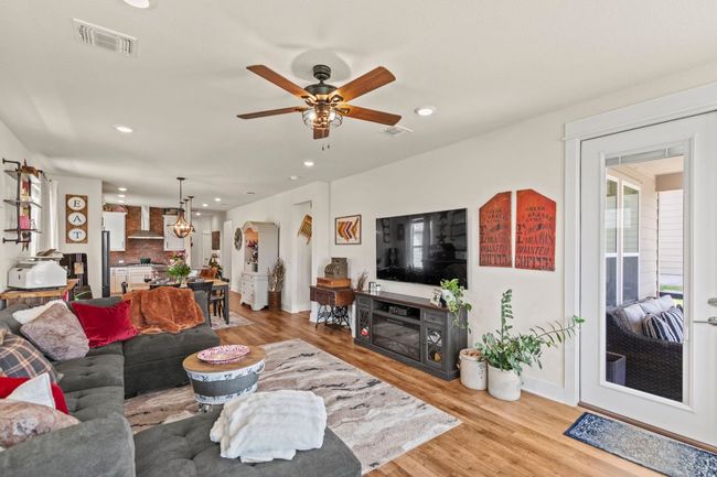Living area featuring recessed lighting, light wood-style floors, and visible vents | Image 17