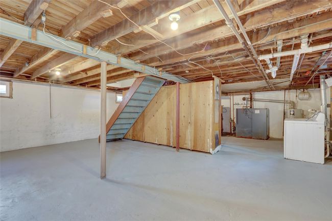 Below grade area with stairway and washer / clothes dryer | Image 16