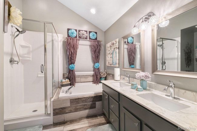 Primary bath with vaulted ceiling. | Image 18