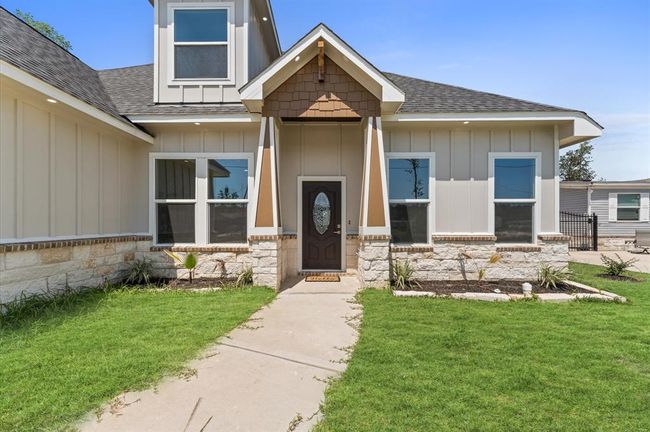 Beautiful new construction with modern curb appeal and extended driveway. | Image 5