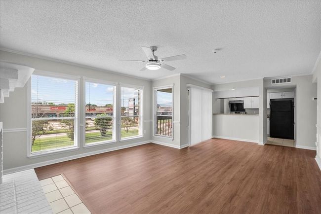 This living room is serving bright, open, and ready for company. | Image 4