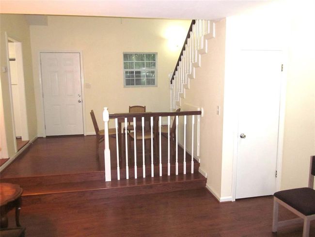 Guest Suite B: Living and Dining rooms, staircase leading to upstairs bedroom | Image 45