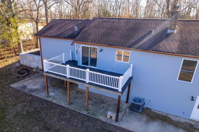 Back of house with a deck and central AC unit | Image 10