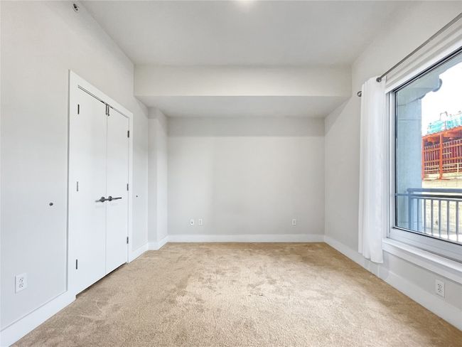 Unfurnished bedroom with carpet floors and baseboards | Image 15