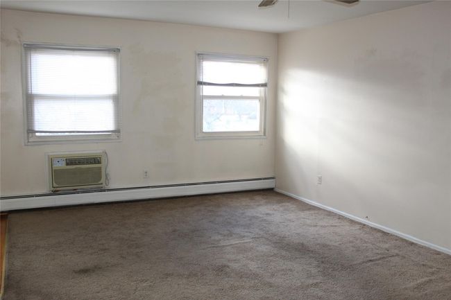 Loads of natural light, carpeted with baseboard heating | Image 12