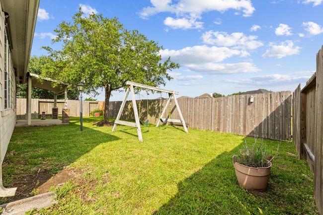 Backyard comes with covered patio area and a Tuff shed for additional storage | Image 41