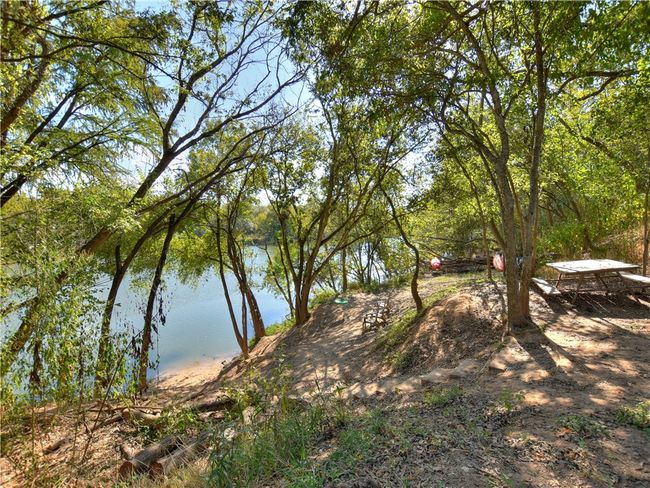 Knollwood on the Colorado River has 251 homes less than 5 miles East of downtown Austin. Amenities include 3 mailbox clusters shaded by trellises, 2 park lots: corners of Lane City Drive/Bay City Bend and Alleyton Drive/Spanish Camp Cove, a 12 Acre HOA private riverfront park on the Colorado River offering a mowed trail, picnic area with: tables, Adirondack chairs, kids tree swings, canoe & kayak launch. Plus you can take the Walnut Creek hike and bike path to Govalle Park & downtown Austin to the West or The YMCA & the Austin Tennis Center to the North. The entrance to the hike and bike path is on Delwau Lane just past the bridge over Boggy Creek. The annual HOA fee is only $275 per year which takes care of the common areas of the community. | Image 38