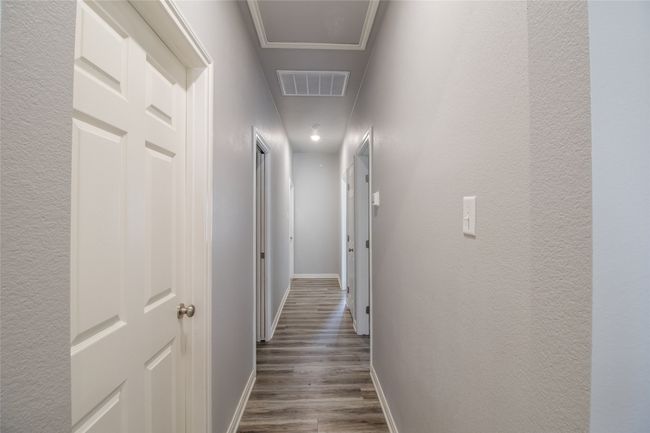 Hallway with wood finished floors and baseboards | Image 14