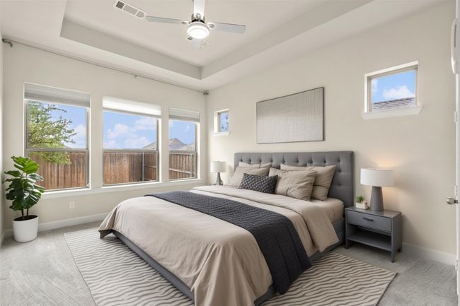 Virtually staged Master bedroom bedroom featuring baseboards, multiple windows, and ceiling fan | Image 19
