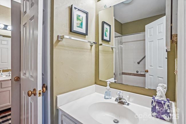 Laundry and storage off powder room | Image 22
