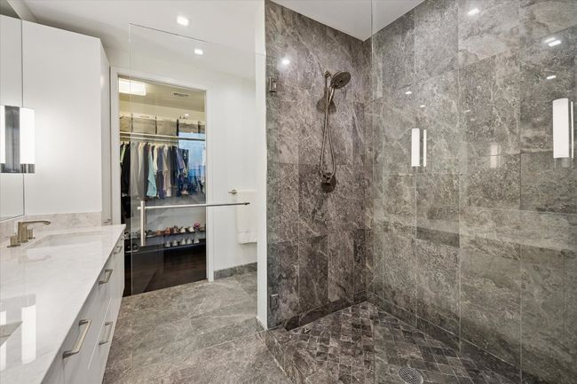 Marble ensuite with seamless glass shower | Image 14