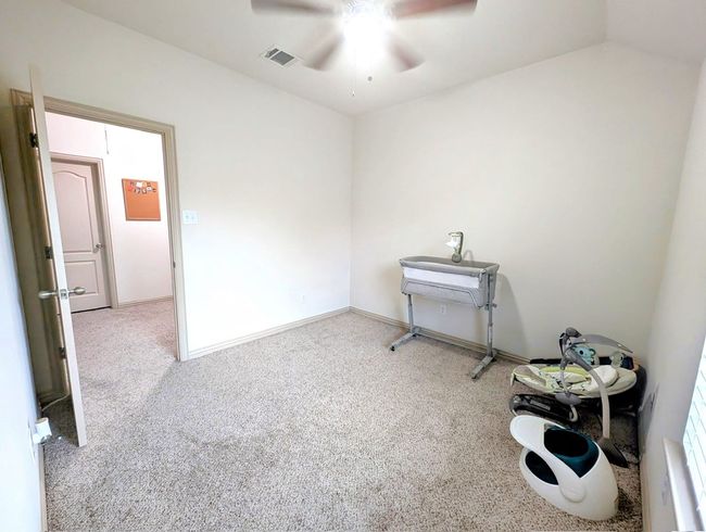 Empty room with ceiling fan and carpet | Image 30