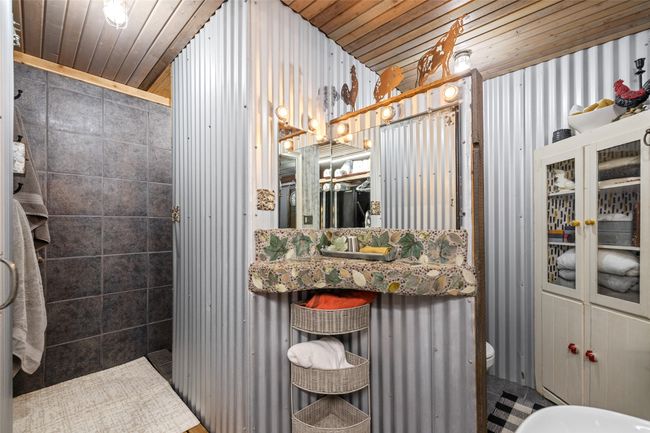 Full bathroom with wooden ceiling and toilet | Image 37