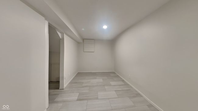 finished basement with baseboards and recessed lighting | Image 17