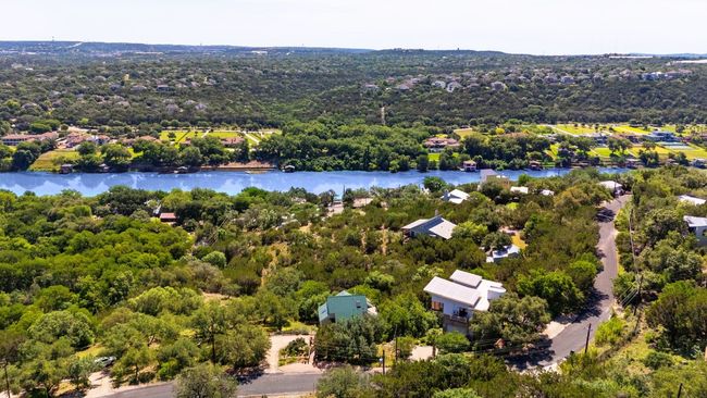 Aerial view of a nearby body of water and a heavily wooded area | Image 35