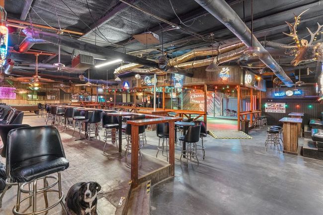 Indoor dry bar with concrete flooring | Image 23