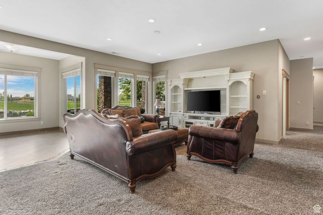 Living area featuring baseboards, a wealth of natural light, and recessed lighting | Image 12