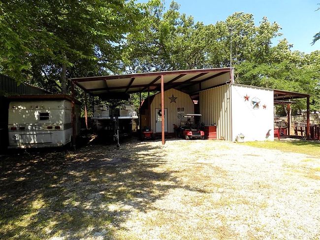 View of outdoor structure featuring a carport | Image 1