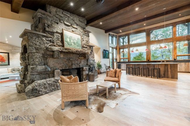 The double sided stone fireplace is a work of art. | Image 19