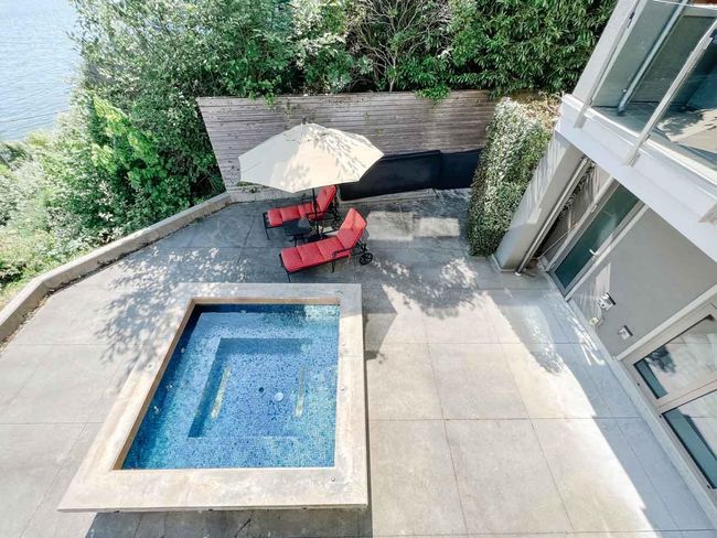 View of pool with a patio and a fenced backyard | Image 20