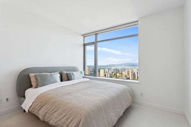Bedroom featuring a city view, a mountain view, carpet floors, and baseboards | Image 20