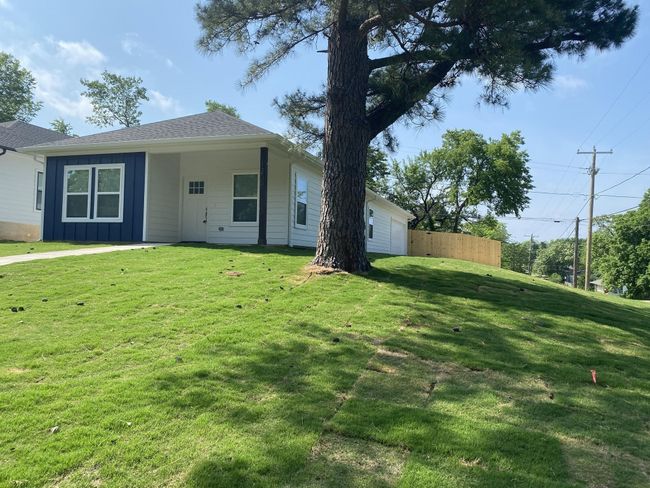 Back of property featuring board and batten siding | Image 15
