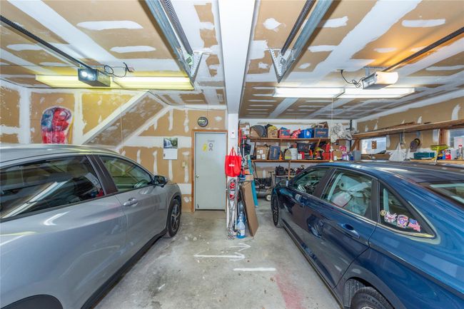 Garage with a garage door opener | Image 39