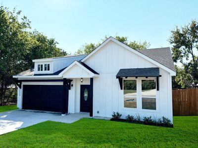 Modern farmhouse with a garage and a front yard | Image 3