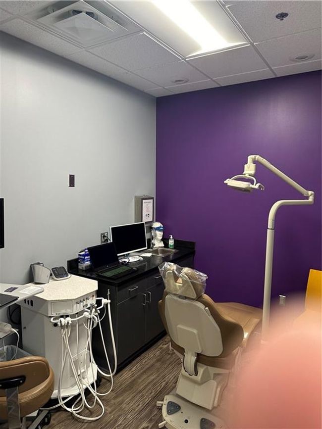 Office with a drop ceiling and dark hardwood / wood-style floors | Image 23