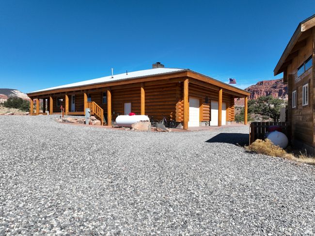 Exterior space with log siding, a mountain view, and a chimney | Image 32